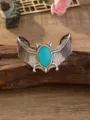 Vintage punk stijl vleermuis manchetarmband voorzien van getextureerde turquoise ovale steen. - Nr. 4 antiekzilver