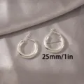 Zilveren C-vormige creolen voor dames, minimalistisch dik hol rond ontwerp, maat van 25mm. - 25mm / Dik Zilver