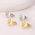Goud en zilver hart zirconia oorknopjes, elegante kristalen sieraden variant stijl. - Letter X