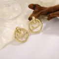 Minimalistische gouden dubbele creolen oorbellen voor vrouwen, stijlvolle sieraden. - Dubbele Ring Geometrische Splicing Stijl (A-003) / Goud