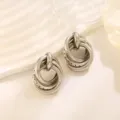 Zilveren geometrische oorbellen met meerdere ringen, stijlvolle minimalistische sieraden. - Multi-Layer 3D Creolen Stijl (A-022) / Witgoud