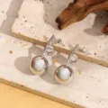 Franse luxe zilveren metalen bal oorbellen met een uniek lusvormig ontwerp nieuwe stijl. - Stijl A005 / Witgoud