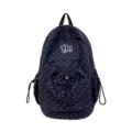 Stylish navy blue polka dot canvas backpack with front pocket, ideal for school. - Navy Blue
