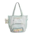Leuke mintgroene ita-tas met doorzichtig voorvak, sterrenborduurwerk und grote opbergruimte. - Zonder Hanger / Groen