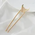 Close-up view of the gold mermaid tail U-shaped hair fork, showing fine details and smooth finish. - Mermaid Skirt