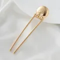 Gold U-shaped hair stick metal octopus detail closeup for elegant daily bun styling. - Squid