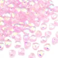 Detailed shot of sparkling pink crystal heart beads with faceted iridescent finish for DIY jewelry crafting. - Pink New AB