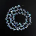Crystal teardrop bead detail, AB coated iridescent glass gemstone, DIY jewelry accessory close-up - Outer Diameter 6mm / AB Color