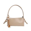 Beige PU leather shoulder bag for women, stylish underarm handbag with cute flower charm. - Apricot
