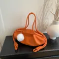 Orange soft leather shoulder bag with cute white pompom and stylish knot drawstring details. - With Pendant / Orange