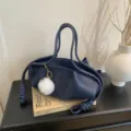 Dark blue soft leather shoulder handbag, elegant cloud tote bag with stylish knot details for women. - With Pendant / Blue