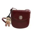 Minimalist glossy PU leather women's cross-body bag with cute doll pendant and metal lock. - Red