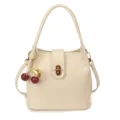 Cream bucket shoulder bag with chic cherry charm, stylish retro PU leather crossbody bag. - Off White