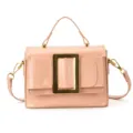 Pink patent leather handbag with a chic gold buckle, top handle, and shoulder strap. - Pink