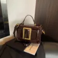 Vintage patent leather handbag with metal buckle, stylish retro shoulder bag for women daily commute. - Coffee