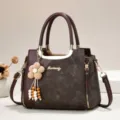 Elegant vintage color-block women tote bag with cute flower pendant and multi-layer crossbody design. - Length 24 Width 12 Height 19 Handle 12cm / Coffee