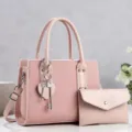 Pink women's commuter handbag set with matching pouch and heart key charm stylish design. - Pink