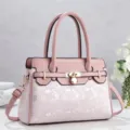 Pink faux leather tote bag with stylish lock closure and unique digital print for women daily. - Pink