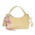 Light yellow leather handbag with cute puppy plush charm, stylish shoulder crossbody bag. - With Charm / Yellow