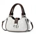 Close-up detail of the luxury contrast color women handbag with digital print and metal clasp. - L25 W7 H15 Handle 15cm / White