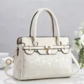 Close-up view of white color-block tote bag featuring metallic lock and digital print. - Off White