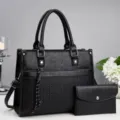 Elegant black women handbag and wallet set with textured design, top handles and shoulder strap. - L30xW12xH24cm / Black