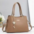 Detailed view of women handbag pendant strap hardware texture fashion casual style everyday use. - 28x13x20cm / Khaki