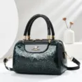 Elegant patent leather boston handbag with floral embossing, top handle and shoulder strap. - L24 W13 H16 Handle 13cm / Green