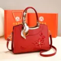 Red leather handbag with delicate floral embroidery, top handle and crossbody strap. - Gift Box Edition / Burgundy