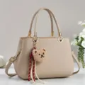Beige commuter handbag with cute bear pendant and tassel decor, elegant daily tote bag for women. - Khaki