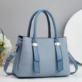 Close up view of the stylish blue tote shoulder bag with premium texture and metal details. - 28x13x20cm / Blue