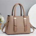 Detail view of stylish women tote handbag featuring woven texture and brown leather handles. - 28x13x20cm / Khaki