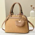 Stylish women's handbag with textured fabric, brown leather trim, and chic mini pouch charm detail. - L 29 W 13 H 21 Handle 14 cm / Khaki