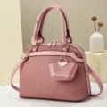 Stylish pink dome handbag for women with shoulder strap and chic pleated texture design. - L 29 W 13 H 21 Handle 14 cm / Pink