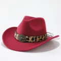 Close-up view of red felt cowboy hat with leopard leather band and vintage metal bull skull. - Adult 57cm / Burgundy