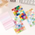 Close-up detail of colorful Korean pop memo pads and grid sticky notes on clean desk. - Korean Index Stickers