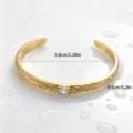 Vintage style Hawaiian vine pattern open cuff bracelet in gold plated titanium steel detail view. - Vine Pattern Style (XYB0026) / Gold