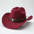 Detail shot of wine red wool felt western cowboy hat with leather band and metal bull skull. - 56-58cm / Burgundy