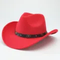 Detail view of the red western cowboy hat, featuring a black studded band and rolled brim design. - 56-58cm / Red