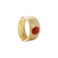 Close-up of a wide gold-tone textured cuff bracelet featuring a striking red stone detail. - Vintage Hammered Round Gemstone Bracelet (B3982)