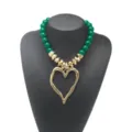 Chic green acrylic beaded statement necklace featuring an irregular gold heart pendant. - Dark Green