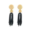 Close-up of bohemian long gold disc and black tassel earrings detail design. - Earrings / Gold