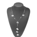 Detailed view of a silver Y-shaped long necklace featuring elegant metal flower and leaf charms. - Silver Necklace