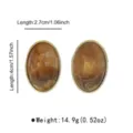 Vintage oval marbled resin stud earrings with metallic rim, lightweight elegant jewellery design. - Oval Swirled Resin Stud Earrings (E15299)