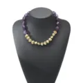 Detailed view of the vintage irregular resin and metallic heart bead necklace fashion jewelry. - Purple
