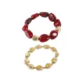 Detail view of stylish irregular acrylic and gold beaded bracelets, retro fashion jewelry. - Bracelet / Red