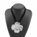 Multi-layer velvet cord statement necklace with a large textured silver flower pendant. - Black Cord Silver