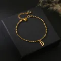 Gouden kralen armband met letter D hanger, elegante 18k vergulde koperen sieraden voor dames. - Letter D