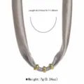 Detail view of grey fabric necklace with gold rings, showing precise length and light weight. - Gray