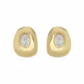 Close up of irregular gold geometric stud earrings featuring an elegant white stone inlay design. - E14539